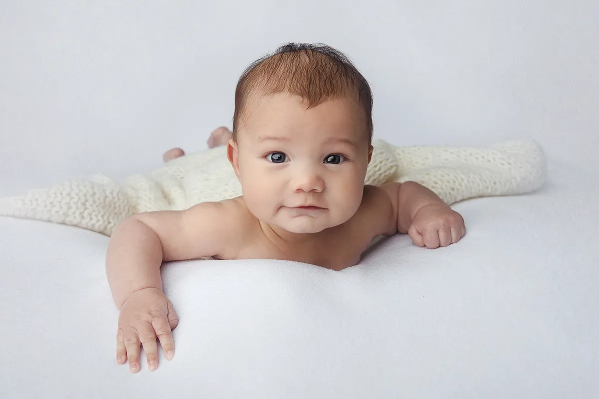 Baby milestone portrait photographed during 100 day photography session in Auckland